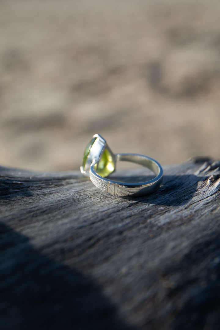 Faceted Teardrop Peridot Ring in Claw Sterling Silver - Size 7 US