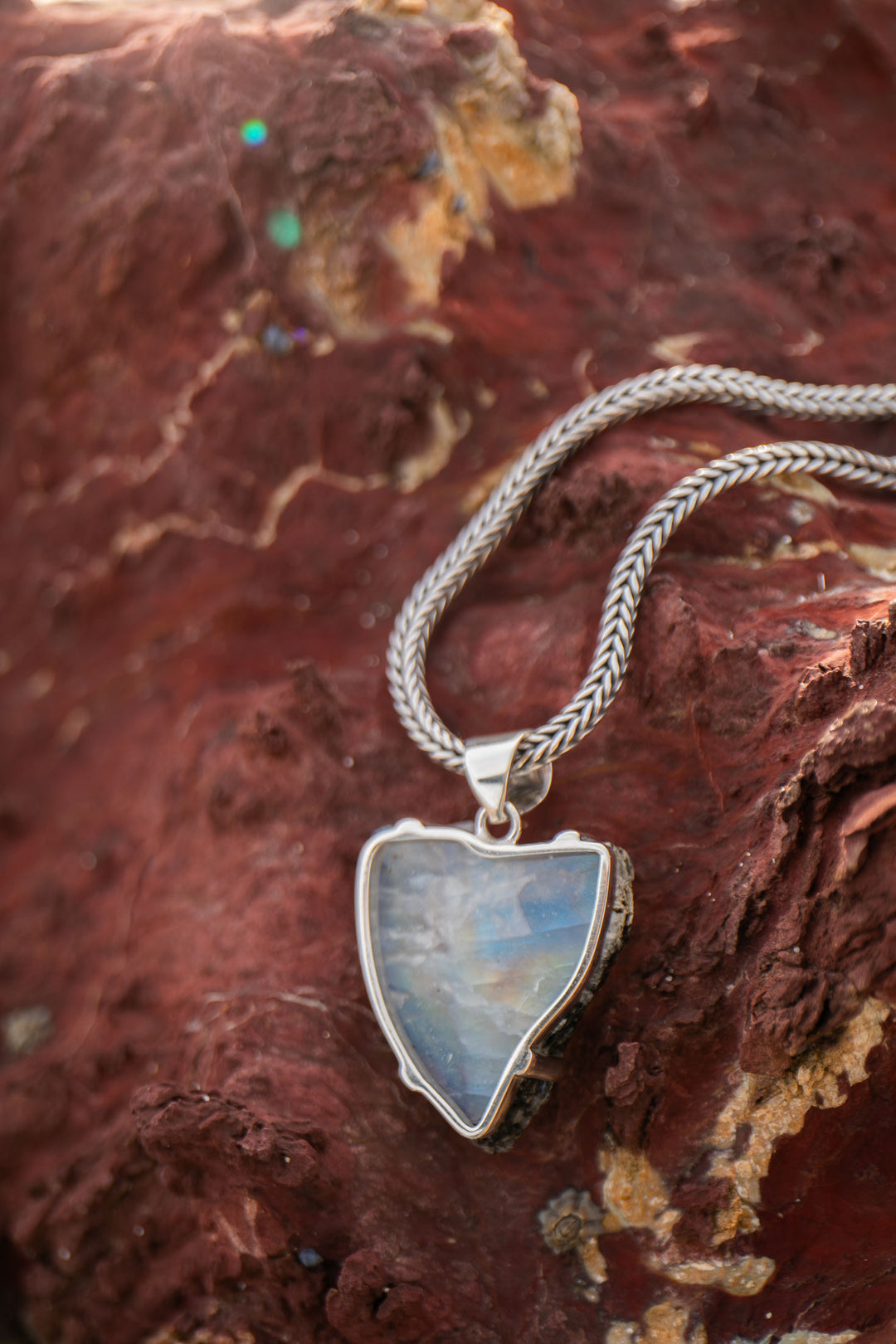 Raw Rainbow Moonstone Pendant in Sterling Silver Claw Setting