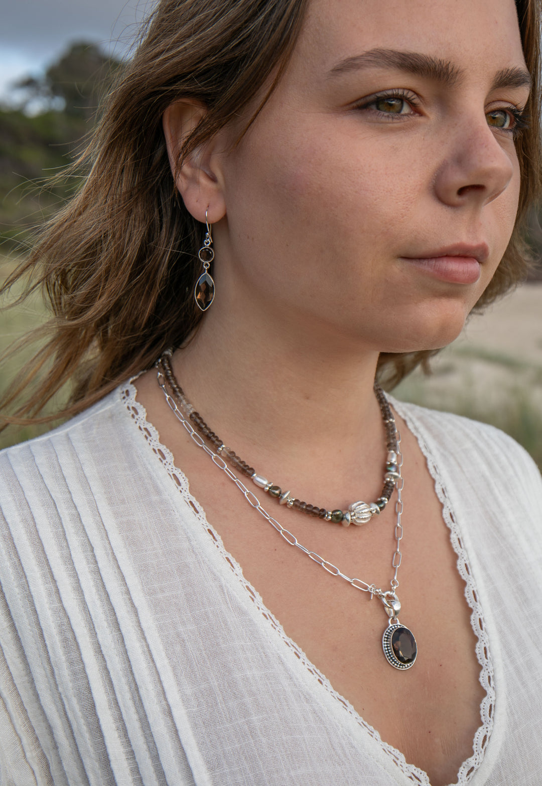 Faceted Smokey Quartz Pendant set in Decorative Sterling Silver Setting