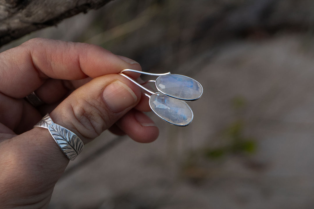 Faceted Oval Rainbow Moonstone Earrings Edged in Sterling Silver