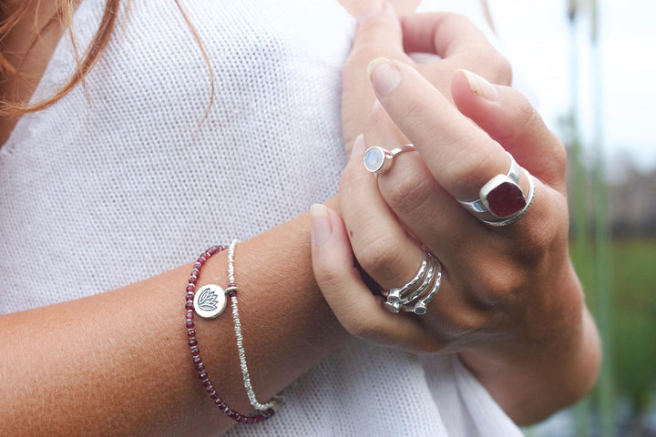 Garnet and Hill Tribe Silver Double Strand Bracelet with Lotus Charm