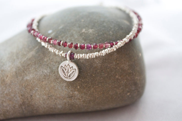 Garnet and Hill Tribe Silver Double Strand Bracelet with Lotus Charm