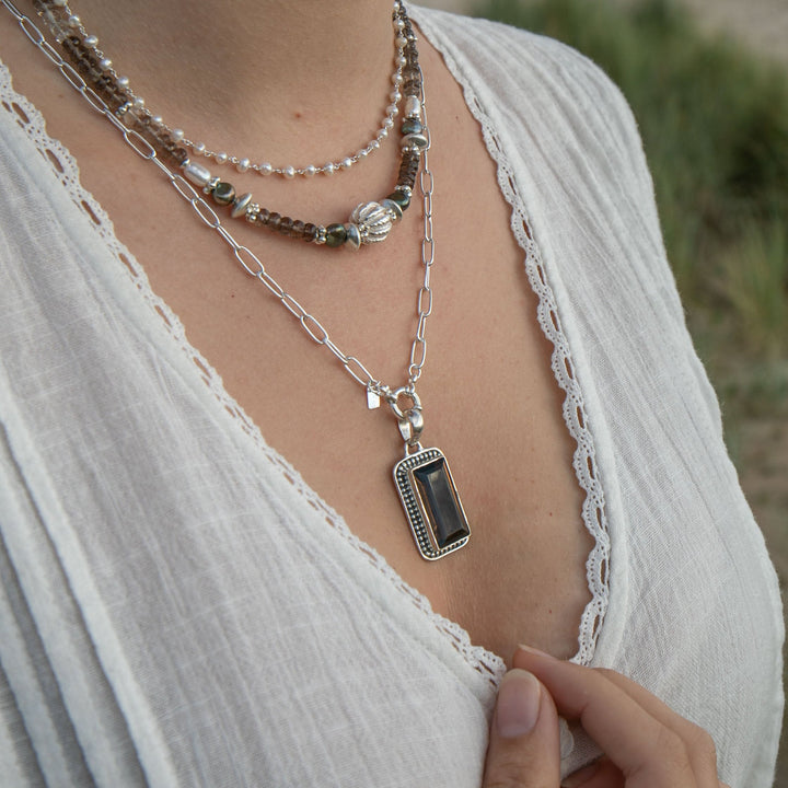 Faceted Smokey Quartz Pendant set in Decorative Sterling Silver Setting